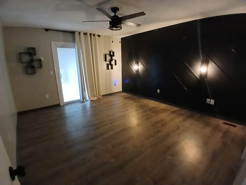 Cozy bedroom, dark walls & lighting — recent Creed Handyman job in Wichita